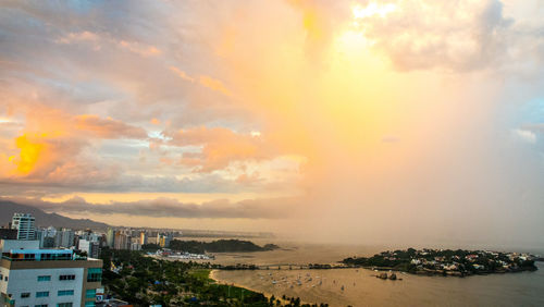Scenic view of beach against sky during sunset