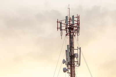 Low angle view of communications tower against sky