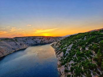 Scenic view of sea against sky during sunset