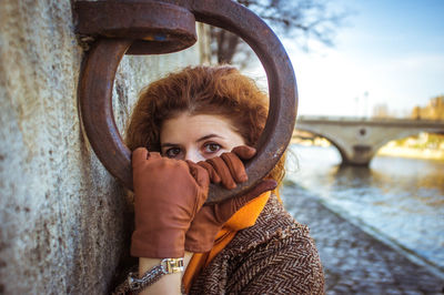 Close up of woman standing on bridge