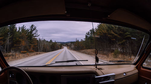 Road seen through car windshield