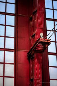 Low angle view of red building against sky