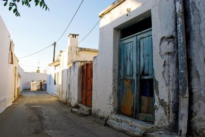 Exterior of abandoned house against sky