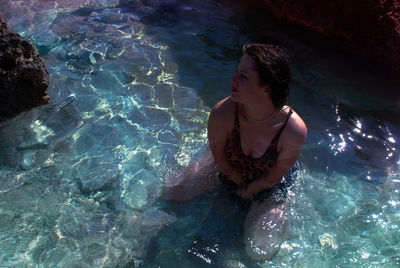 High angle view of woman swimming in pool