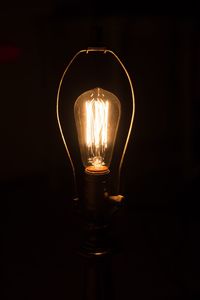 Close-up of illuminated light bulb