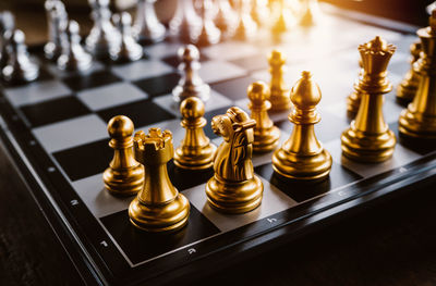 Close-up of chess pieces on table