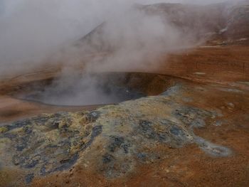 Smoke emitting from volcanic mountain