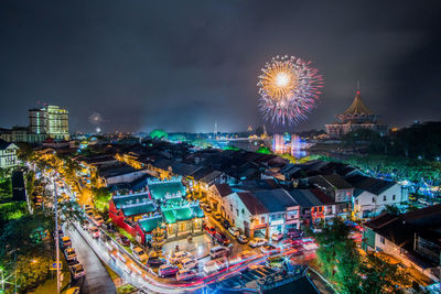 High angle view of illuminated buildings in city at night