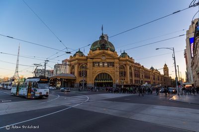 City street against cloudy sky