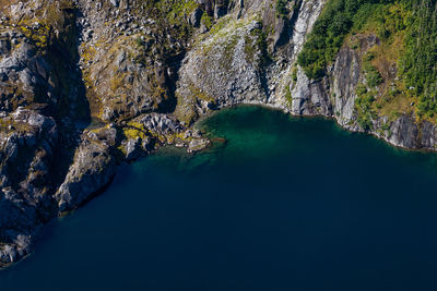 High angle view of lake amidst rock formation
