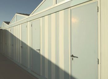 Sunlight falling on wooden beach huts