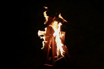 Close-up of bonfire against black background