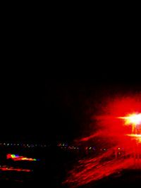 View of illuminated ferris wheel at night