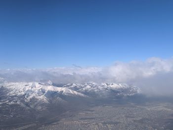 Scenic view of snowcapped mountains against sky