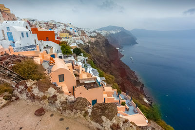 High angle view of townscape by sea