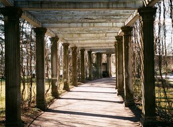 Corridor of historic building against sky