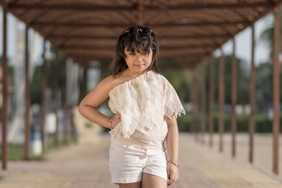 Portrait of woman standing outdoors
