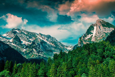 Scenic view of snowcapped mountains against sky