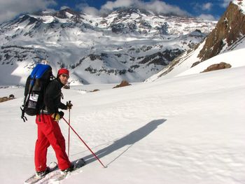 Portrait of male hiker hiking on snowcapped mountain