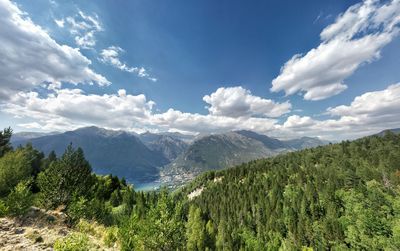 Scenic view of mountains against blue sky