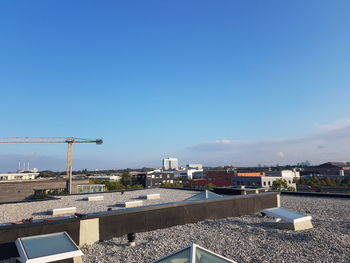 Modern cityscape against clear blue sky