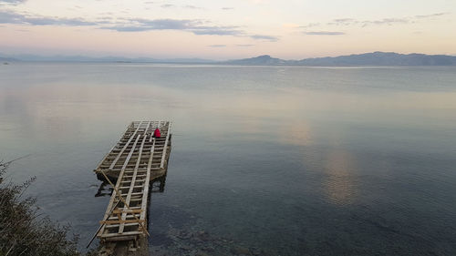 High angle view of sea against sky at sunset