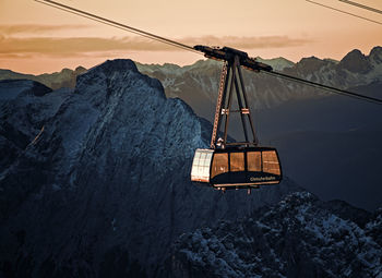 Overhead cable car against sky during winter