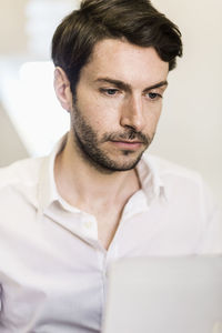 Businessman working on laptop in office