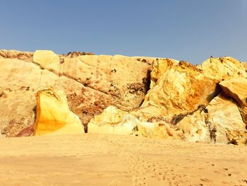 Rock formations in desert against clear sky