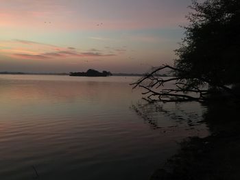 Scenic view of sea against sky at sunset