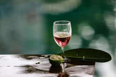 Close-up of wineglass on table