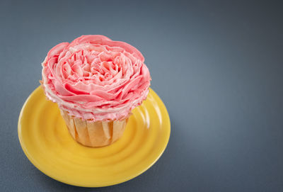 Close-up of pink cake against white background