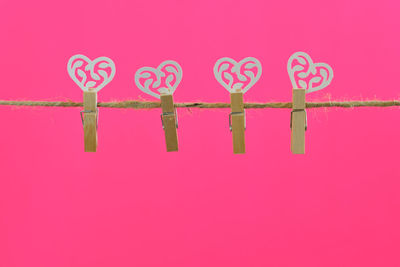 Close-up of heart shape on pink background