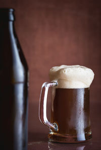 Close-up of beer glass on table