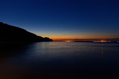 Scenic view of sea against sky at night