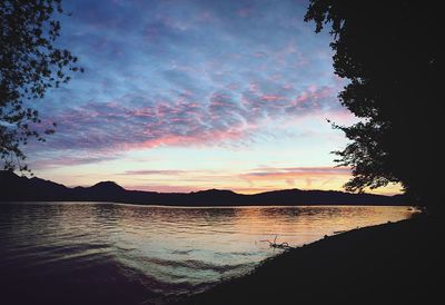 Scenic view of lake at sunset