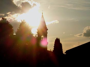 Sun shining through building