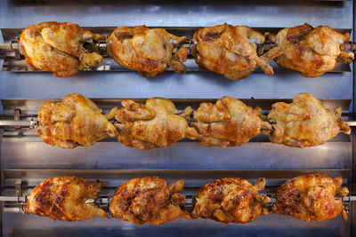 High angle view of roasted meat on barbecue grill