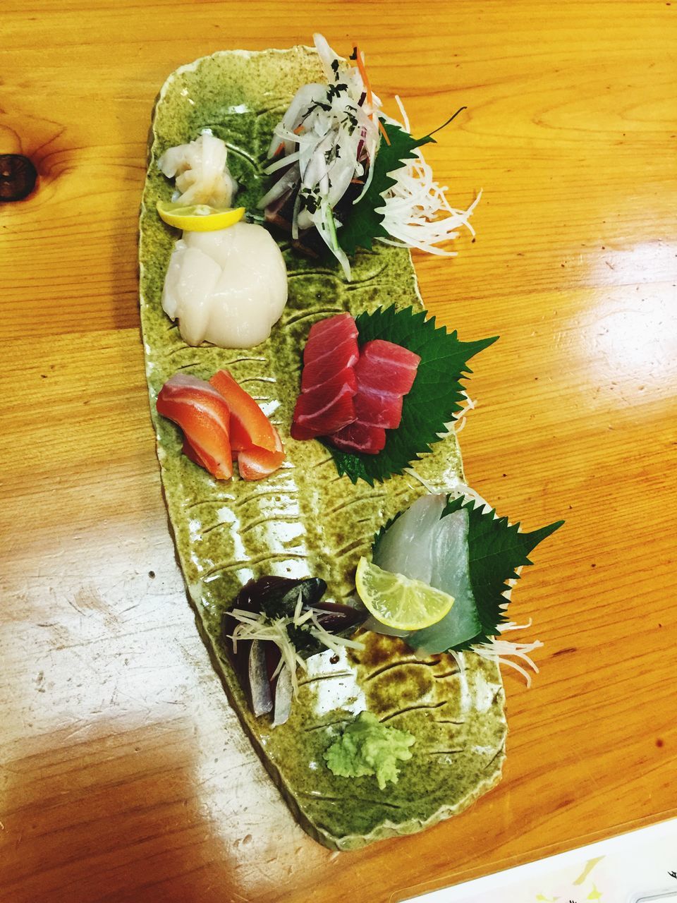 indoors, table, high angle view, freshness, wood - material, food, still life, food and drink, leaf, directly above, healthy eating, wooden, no people, flower, variation, vegetable, wood, close-up, plate, decoration