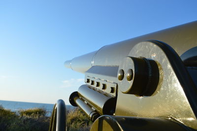 Low angle view of airplane wing against clear sky