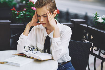 Depressed woman sitting at cafe