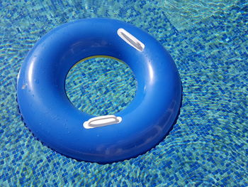 High angle view of blue inflatable ring in swimming pool