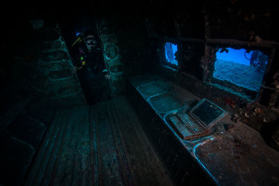 Scuba diver exploring shipwreck