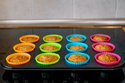 Muffins in colorful silicone trays