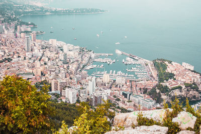 High angle view of townscape by sea