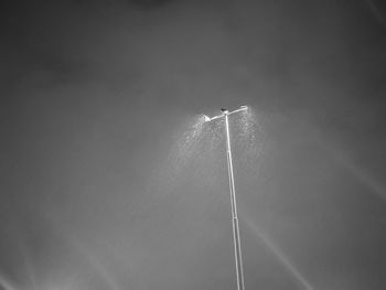 Low angle view of vapor trail against sky