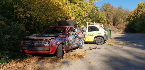 View of abandoned car on road