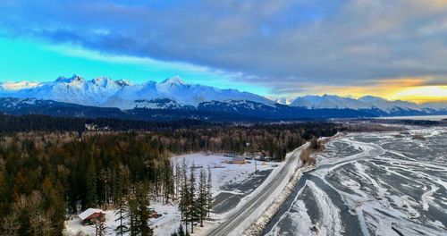 Panoramic view of snowcapped mountains against sky during winter