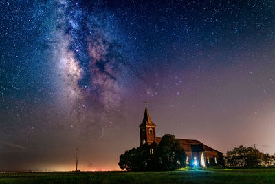Low angle view of church against sky at night