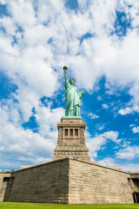 Low angle view of statue against cloudy sky